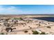 Expansive aerial view of a community, roads, homes, and a large solar farm in a desert landscape under a clear blue sky at 3105 W Romana Dr, Eloy, AZ 85131