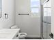 Bathroom featuring a shower with glass doors and a window providing natural light at 3105 W Romana Dr, Eloy, AZ 85131