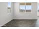 Bright and airy bedroom featuring tile floors, white walls, and multiple windows offering natural light at 3105 W Romana Dr, Eloy, AZ 85131