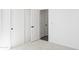 View of a well-lit room with doors, carpeted floors, and white walls at 3105 W Romana Dr, Eloy, AZ 85131