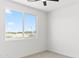Bedroom with a window offering natural light, featuring neutral carpet and fresh paint at 3105 W Romana Dr, Eloy, AZ 85131