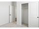 Bright bedroom with a sliding closet door and open door to an adjacent room with carpeted floor at 3105 W Romana Dr, Eloy, AZ 85131
