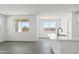 Bright kitchen and living area with an island and large windows that let in plenty of natural light at 3105 W Romana Dr, Eloy, AZ 85131