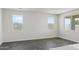 Open-concept living area with tile flooring, white walls, and plenty of natural light from large windows at 3105 W Romana Dr, Eloy, AZ 85131