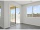An open living area with sliding glass doors leading to the backyard and a large window at 3105 W Romana Dr, Eloy, AZ 85131
