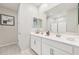 Bright bathroom showcasing double sinks with modern fixtures and a large mirror, providing ample space at 3310 E Valleyhigh Trl, San Tan Valley, AZ 85143
