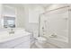 Bright bathroom showcasing white fixtures, a shower-tub combo, and neutral decor at 3310 E Valleyhigh Trl, San Tan Valley, AZ 85143
