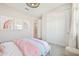 Neutral bedroom showcasing closet space, soft carpet, and a comfortable bed with stylish decor at 3310 E Valleyhigh Trl, San Tan Valley, AZ 85143