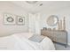 Cozy bedroom featuring a decorative dresser and mirror, creating an inviting and stylish atmosphere at 3310 E Valleyhigh Trl, San Tan Valley, AZ 85143