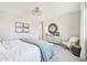 Stylish bedroom featuring art, a decorative mirror, and natural light, creating a relaxing retreat at 3310 E Valleyhigh Trl, San Tan Valley, AZ 85143