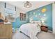 Vibrant bedroom featuring a solar system wall decor, comfortable bed, and natural lighting at 3310 E Valleyhigh Trl, San Tan Valley, AZ 85143