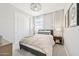 Neutral bedroom featuring a comfortable bed, closet space, and minimalist decor at 3310 E Valleyhigh Trl, San Tan Valley, AZ 85143