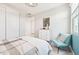 Bright bedroom featuring a comfortable accent chair and closet with lots of natural light at 3310 E Valleyhigh Trl, San Tan Valley, AZ 85143