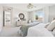 Bright bedroom with large windows, a modern dresser, and a comfortable seating area for relaxing at 3310 E Valleyhigh Trl, San Tan Valley, AZ 85143