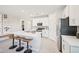 Contemporary kitchen boasts a large island, white cabinetry, and stainless steel appliances at 3310 E Valleyhigh Trl, San Tan Valley, AZ 85143