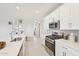 Bright kitchen features quartz countertops, white cabinets, and stainless steel appliances at 3310 E Valleyhigh Trl, San Tan Valley, AZ 85143