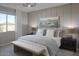 Serene bedroom featuring a comfortable bed, stylish decor, and a view of the outdoors at 3310 E Valleyhigh Trl, San Tan Valley, AZ 85143