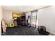 Bonus room with a carpet floor, a game machine and a painting at 48773 Cerezo Rd # 20, Maricopa, AZ 85139