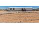 Mobile home with rock landscaping, offering a unique and low-maintenance outdoor space at 48773 Cerezo Rd # 20, Maricopa, AZ 85139