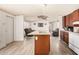 Open kitchen with a center island, offering functionality and views of the living area at 48773 Cerezo Rd # 20, Maricopa, AZ 85139