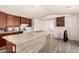 Spacious kitchen features modern cabinets, white appliances, and an island with countertop and sink at 48773 Cerezo Rd # 20, Maricopa, AZ 85139