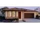 Charming single-story home featuring a two-car garage and beautifully landscaped front yard at 5597 S 253Rd Ave, Buckeye, AZ 85326