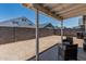 Backyard with a covered patio, a block fence, and seating, offering a private outdoor living space at 5709 S 13Th Ave, Phoenix, AZ 85041