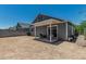 The home's backyard featuring a covered patio, and block fence, offering a private outdoor space at 5709 S 13Th Ave, Phoenix, AZ 85041