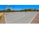 Community basketball court with well-maintained surface, hoop, and surrounding greenery, providing recreational opportunities at 5709 S 13Th Ave, Phoenix, AZ 85041