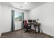 This bedroom is set up as an office space with a window for natural light at 5709 S 13Th Ave, Phoenix, AZ 85041