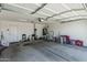 Spacious garage with white door, ample storage space, and utility connections, providing functionality and convenience at 5709 S 13Th Ave, Phoenix, AZ 85041