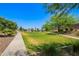 Lush green space with walking paths and mature trees, offering a serene environment for relaxation and recreation at 5709 S 13Th Ave, Phoenix, AZ 85041