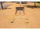 An outdoor horseshoe pit with wooden frame and metal posts awaits friendly competition in a sunny park setting at 5709 S 13Th Ave, Phoenix, AZ 85041