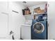 Laundry room features front loading machines and plenty of storage space for detergents at 5709 S 13Th Ave, Phoenix, AZ 85041