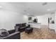 Open-concept living area with wood-look floors that flow into a bright kitchen at 5709 S 13Th Ave, Phoenix, AZ 85041