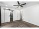The main bedroom features neutral walls, carpet flooring, and access to the main bathroom at 5709 S 13Th Ave, Phoenix, AZ 85041