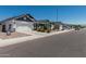 Charming single-story homes with well-maintained landscaping line a quiet street, offering a welcoming neighborhood atmosphere at 5709 S 13Th Ave, Phoenix, AZ 85041