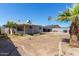 Backyard featuring desert landscaping and a covered patio area, perfect for outdoor living at 5807 W Encanto Blvd, Phoenix, AZ 85035