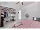 Inviting bedroom with a ceiling fan, closet, and comfortable bed, offering ample storage at 5807 W Encanto Blvd, Phoenix, AZ 85035