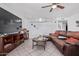 Spacious living room with a leather sectional sofa and a view of decorative decor at 5807 W Encanto Blvd, Phoenix, AZ 85035