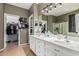 Bathroom with dual sinks, and ample counter space offering a practical and stylish space for daily routines at 609 S 122Nd Dr, Avondale, AZ 85323