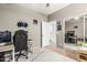 Bedroom featuring a computer desk and chair, complemented by a mirrored closet reflecting the room at 609 S 122Nd Dr, Avondale, AZ 85323