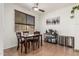 Cozy dining room featuring tile flooring, a ceiling fan, and views of the neighborhood at 609 S 122Nd Dr, Avondale, AZ 85323