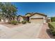 Charming single-Gathering home with a two-car garage, desert landscaping, and well-manicured shrubs at 609 S 122Nd Dr, Avondale, AZ 85323