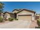 Charming single-Gathering home with a two-car garage, desert landscaping, and well-manicured shrubs at 609 S 122Nd Dr, Avondale, AZ 85323