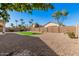 Well-maintained backyard with putting green, desert landscaping and block wall at 640 W Country Estates Ave, Gilbert, AZ 85233