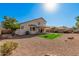 Large backyard featuring low maintenance desert landscaping, and a patch of artificial turf at 640 W Country Estates Ave, Gilbert, AZ 85233