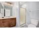 Bathroom featuring wood cabinets, shower and tile floors at 640 W Country Estates Ave, Gilbert, AZ 85233
