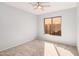 Cozy bedroom featuring carpeted floors and a window to enjoy the views at 640 W Country Estates Ave, Gilbert, AZ 85233