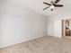 Neutral bedroom with carpeted floor, ceiling fan, and access to the bathroom at 640 W Country Estates Ave, Gilbert, AZ 85233